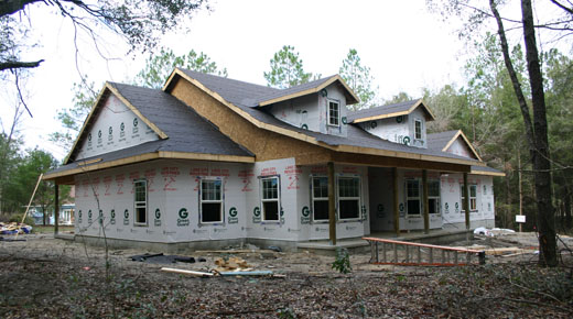 Newberry Architect, photo of custom home under construction, wood framed exterior walls